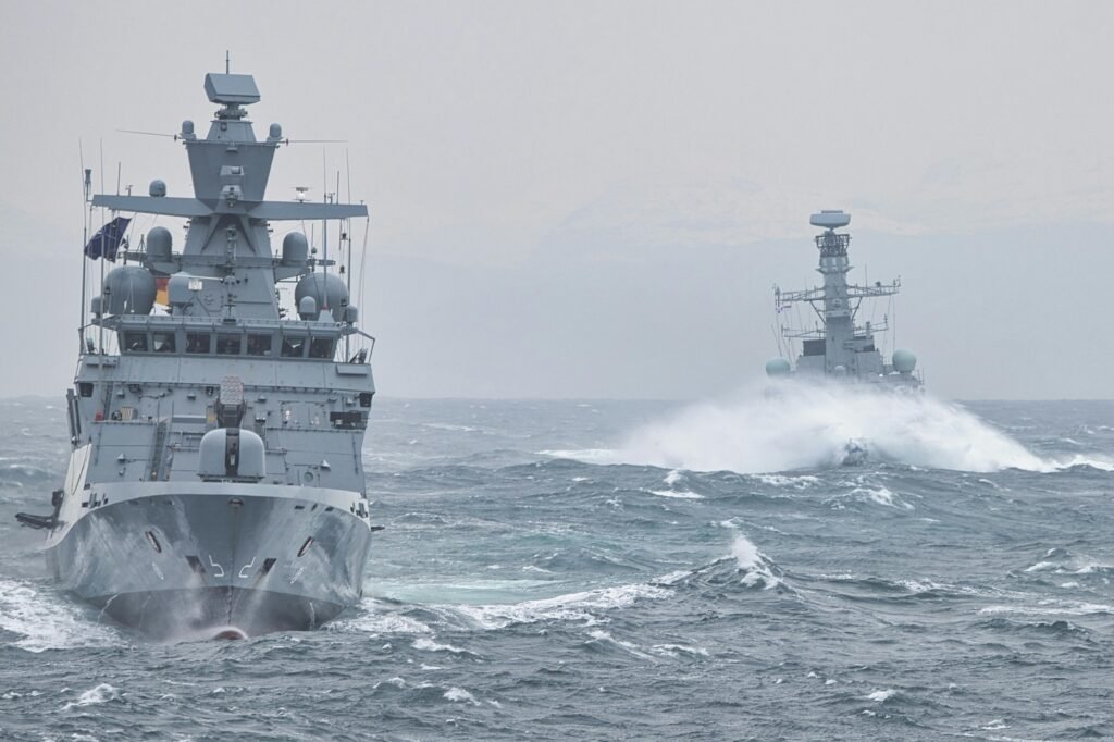 pexels photo 13342949 13342949 Navy warships navigating turbulent ocean waters showcasing maritime strength.